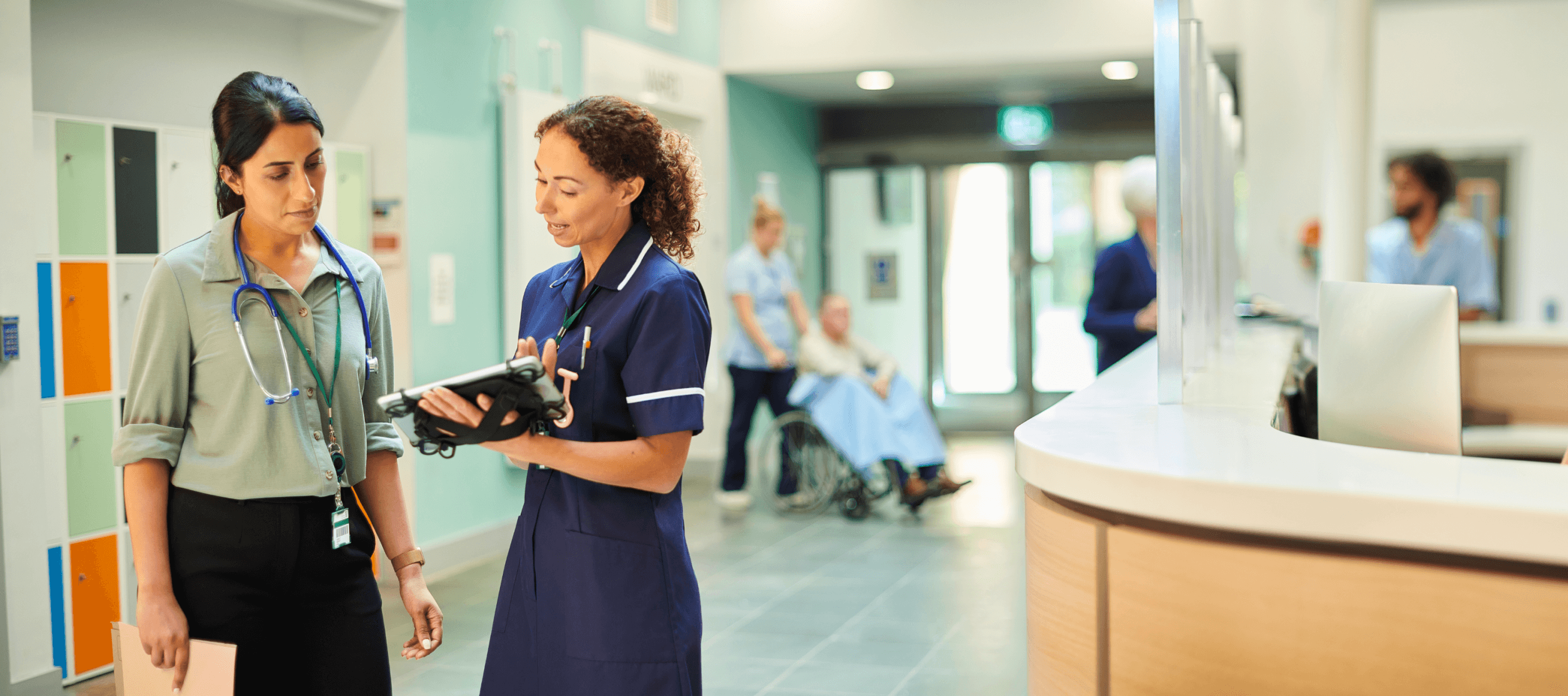 Doctors and nurses talking with a tablet device in a hospital